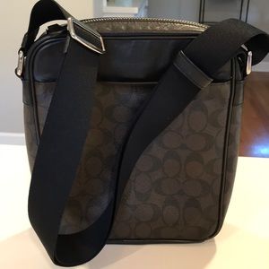 Stylish unisex Coach crossover travel bag.